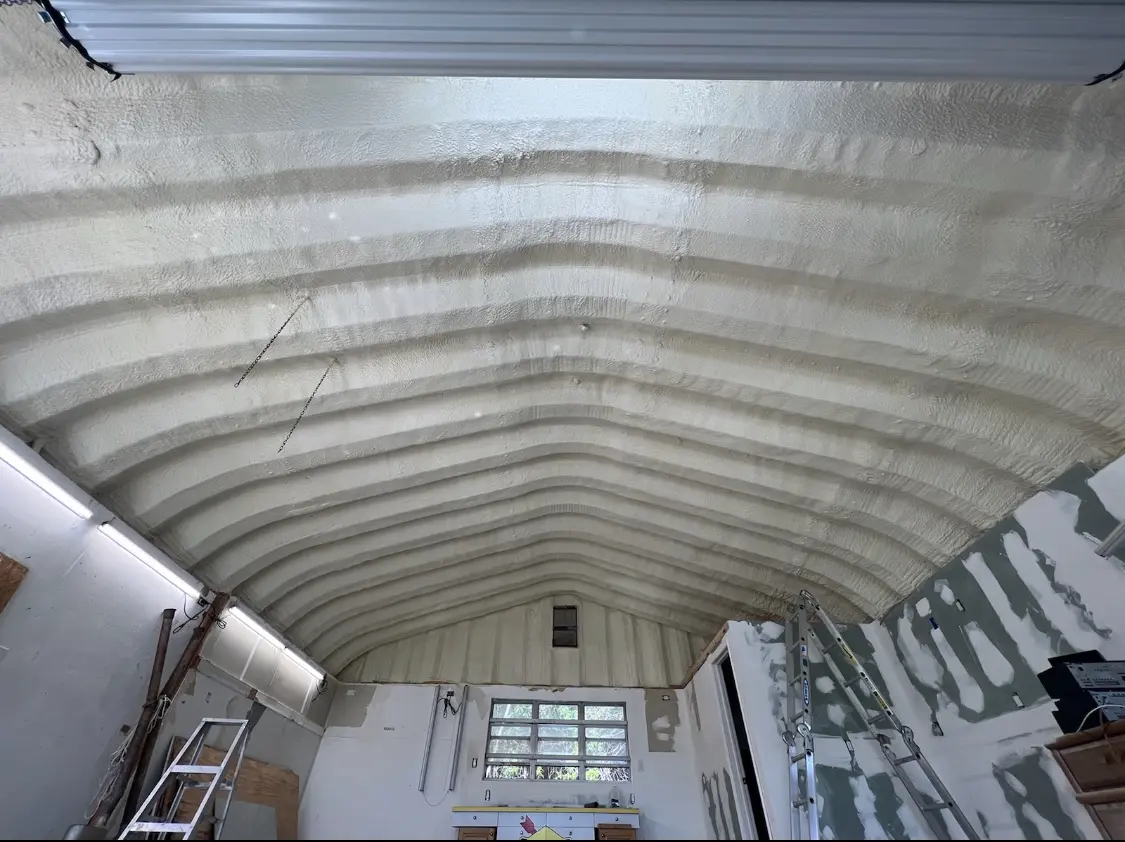 Spray polyurethane foam applied to the underside of a metal roof deck in Union